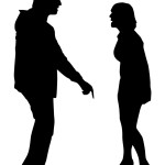 Silhouettes of a man and woman arguing